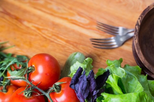 Background from mixed vegetables with wood board