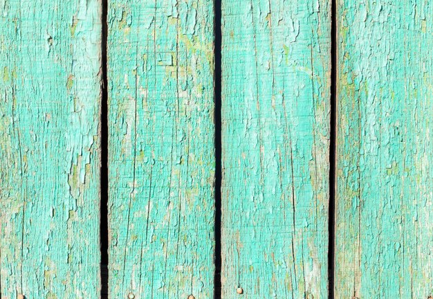 Background from old boards with peeling green paint