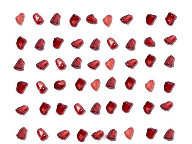 Background from pomegranate seeds White background Isolate