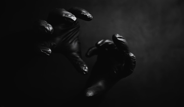 Background of hands in black gloves Horror and hand monsters Black hand gestures