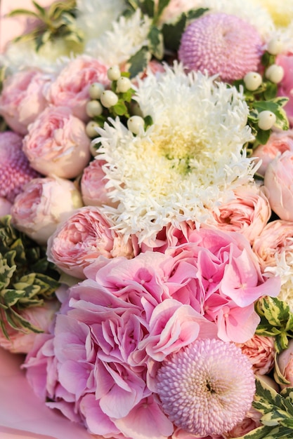 Background image of a bright bouquet of flowers Pink hydrangea closeup peony roses