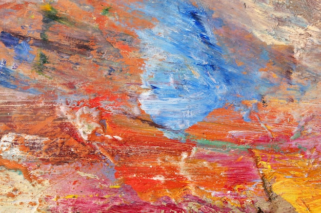 Background image of bright oil-paint palette closeup.