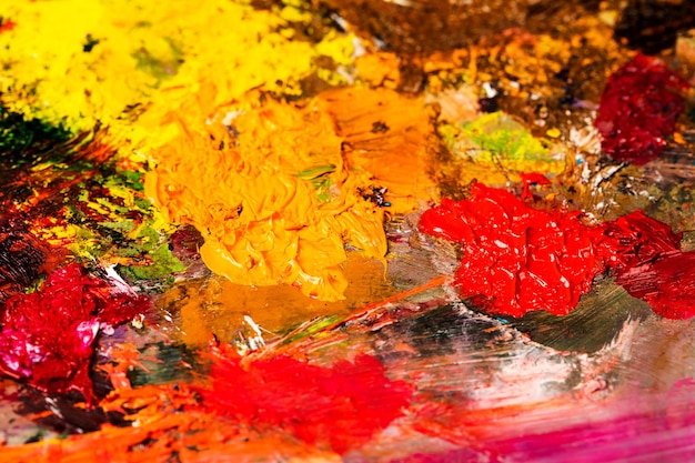 Background image of bright oilpaint palette closeup