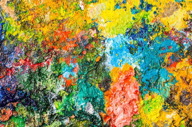 Background image of bright oilpaint palette closeup