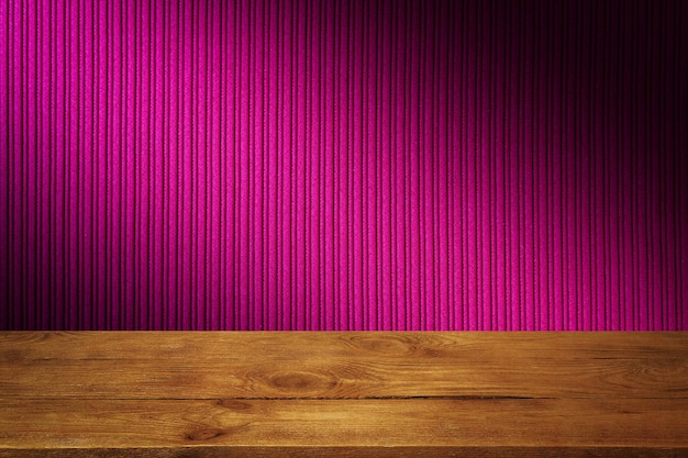 The background is blank wooden boards and a textured striped wall with gradient lighting