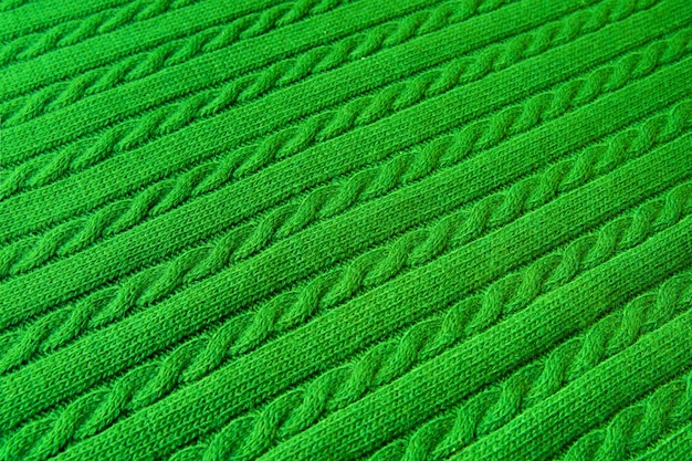 Background made of knitted ornament texture. Macro photo.