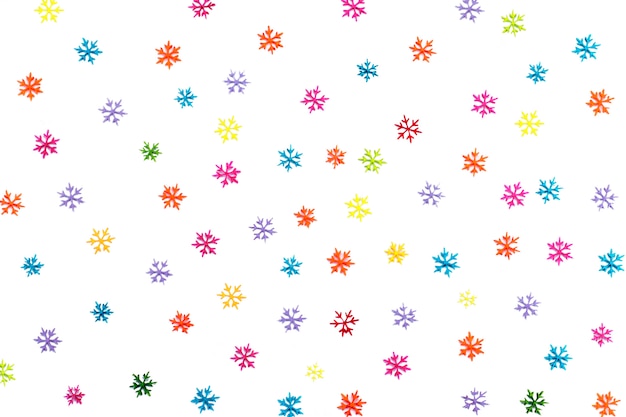 Background of many different colored snowflakes.Isolated