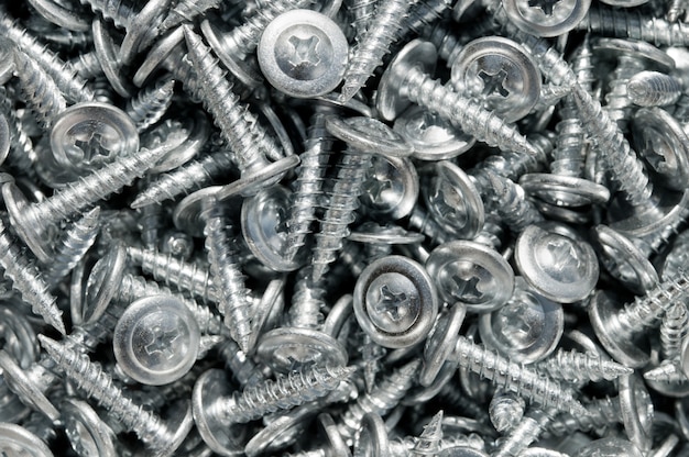 Background of metal screws. Top view.