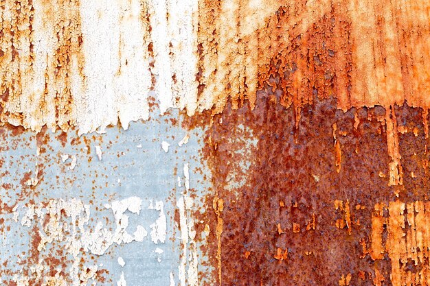 A background of peeling paint and rusty old metal