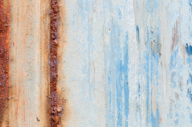 A background of peeling paint and rusty old metal