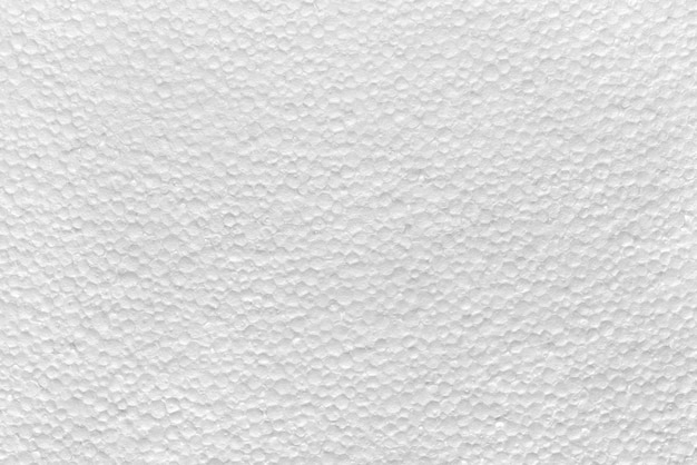 Background, photo texture from porous material, white polystyrene close-up.