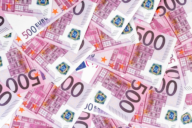 background of a pile of money with par value of five hundred euro, close-up