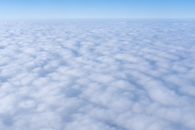 Background of a pink purple heavenly sky with fluffy dense clouds top view from an airplane Sky Gradient