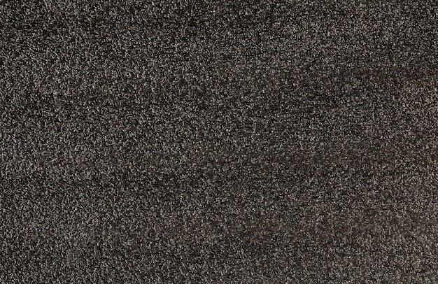 Background of soft black polyester fabric with wet asphalt texture