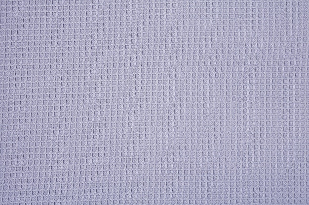 Background of soft blue cotton fabric in a small cell