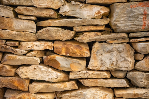 Background of stone wall texture of architecture in old town of Vela Luka, Korcula island in Croatia