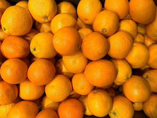 Background of sweet orange oranges or tangerines Texture of oranges or tangerines