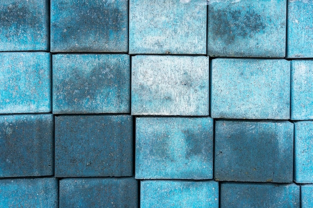 Background and texture of blue paving tiles for paths in the city