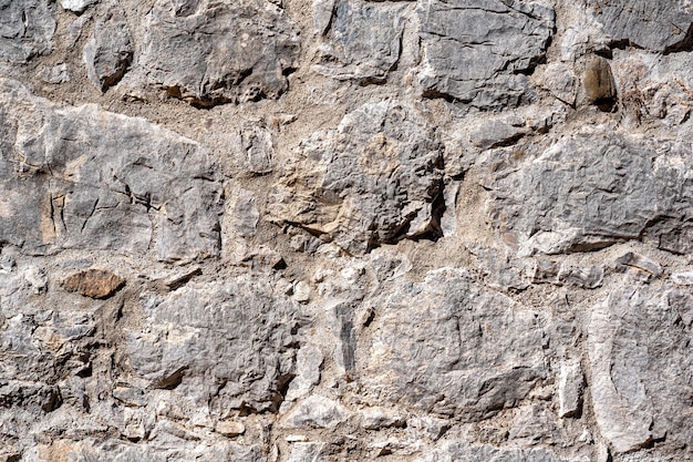 Background, texture - gray ancient roman masonry wall