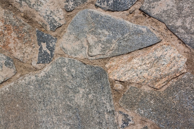 Background texture masonry from large stones with cement. Horizontal image.