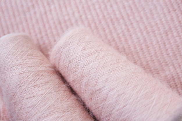 Background texture of pink pattern knitted fabric made of angora or wool.