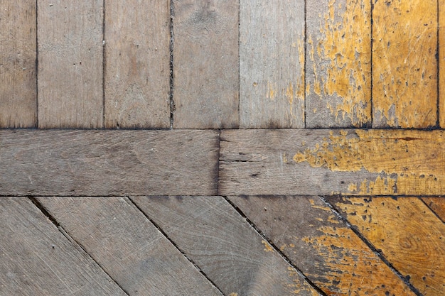 Background texture of the surface of an old wooden parquet