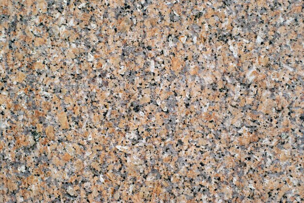 Background, texture - surface of slab of gray granite with orange splashes