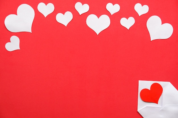 Background for Valentine's day. White with a red heart, white hearts on a red background.