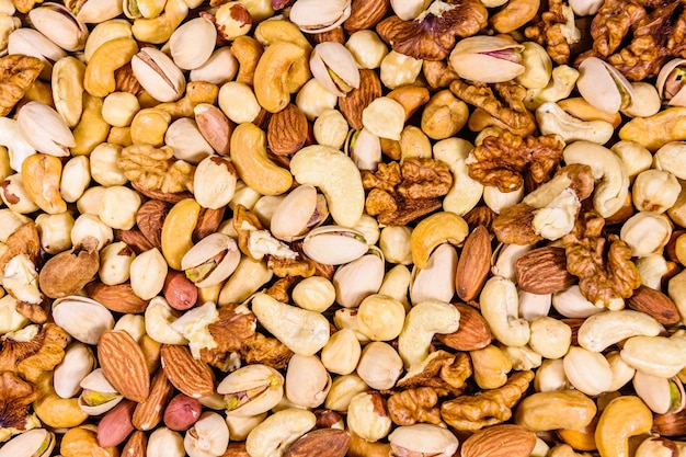 Background of the various nuts almond cashew hazelnut pistachio walnut Vegetarian meal Healthy eating concept