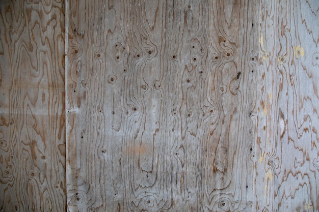 Background wall wooden facade of raw wood plank gray aged by time