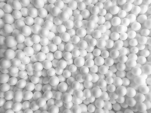 Photo background of white circle styrofoam ball pattern texture foam surface abstract background