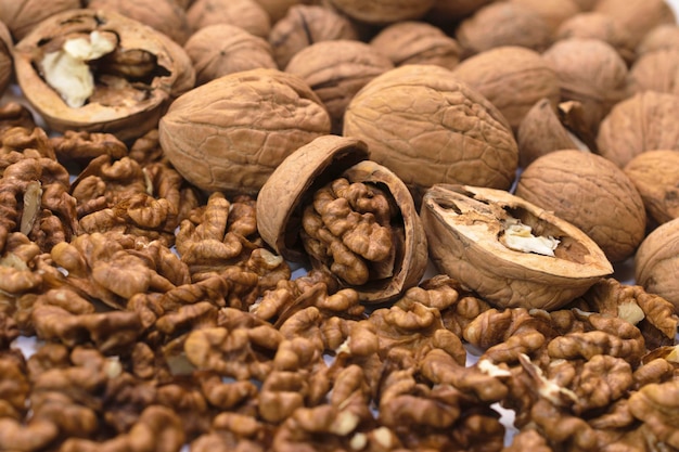 Background of whole and peeled walnuts