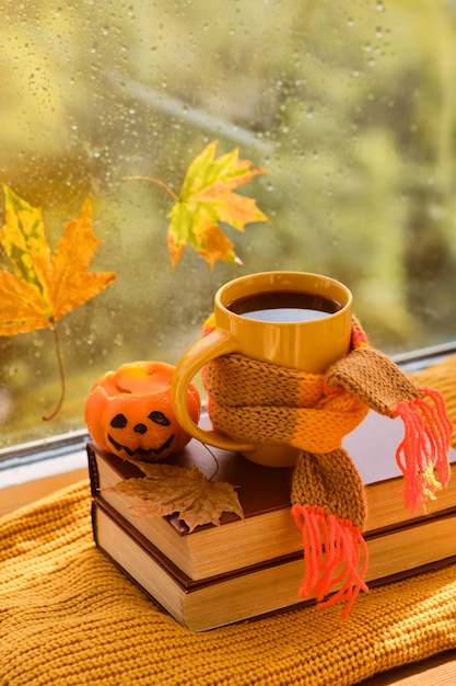 Background with books, cup of tea, pumpkin