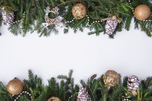 background with Christmas tree branches and Christmas toys place for text