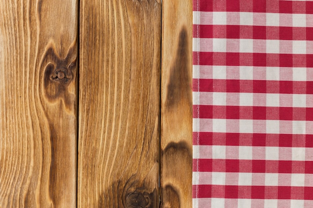 Background with empty wooden table with tablecloth