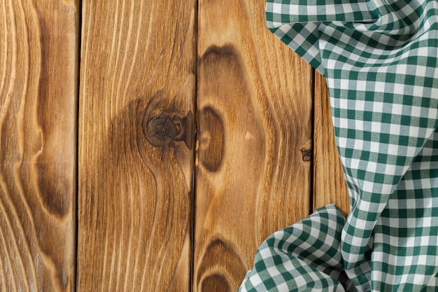 Background with empty wooden table with tablecloth