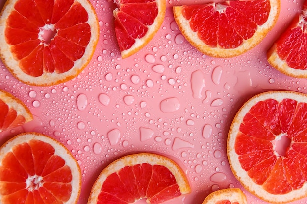 Background with grapefruit and water drops Selective focus