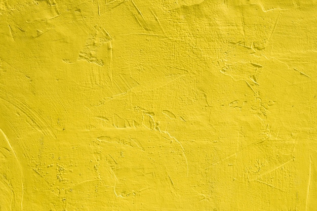 Background with wall texture with yellow paint.