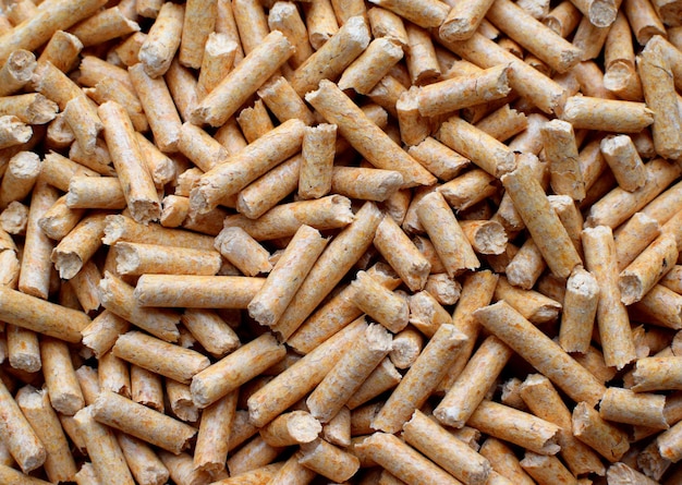 Background of wood filler pellets for animals Litter for cats and rodents closeup