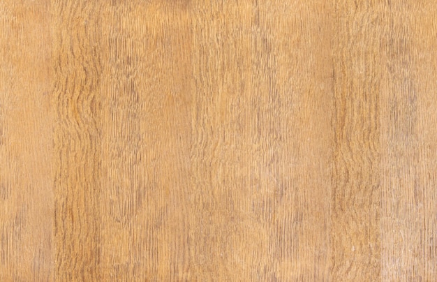 Background of a wooden plate of brown color with traces of wear