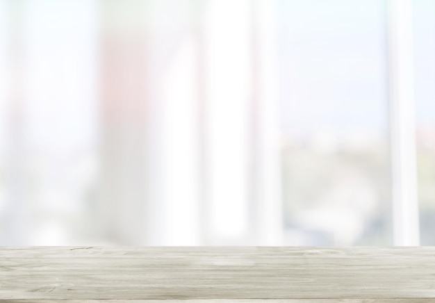 background of wooden table in front of abstract blurred window light