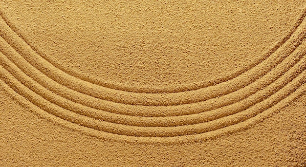 Background of yellow warm sand in summer with an abstract pattern