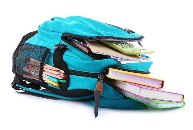 Backpack with school supplies isolated on white