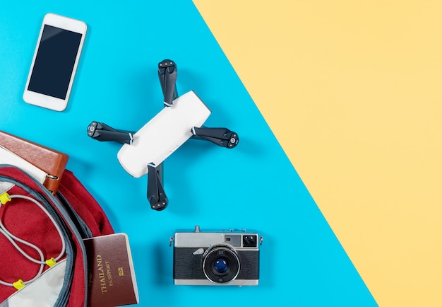 Backpacker tourist travel gadgets and objects in Backpack with drone and camera vlogger objects