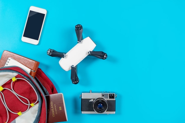 Backpacker tourist travel gadgets and objects in Backpack