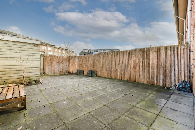 A backyard with a tiled floor