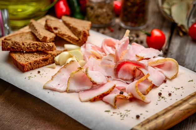 Bacon and bread on a wooden board