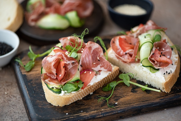 Bacon sandwich with vegetables and cream cheese