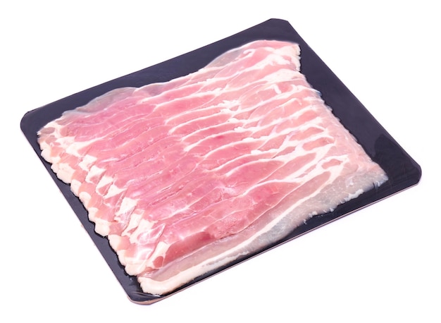 Bacon strips on black package paper for wholesales isolated on white background