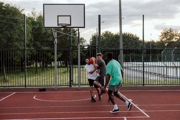 Bad moment at basketball court friends and african american basketball player playing showing skills